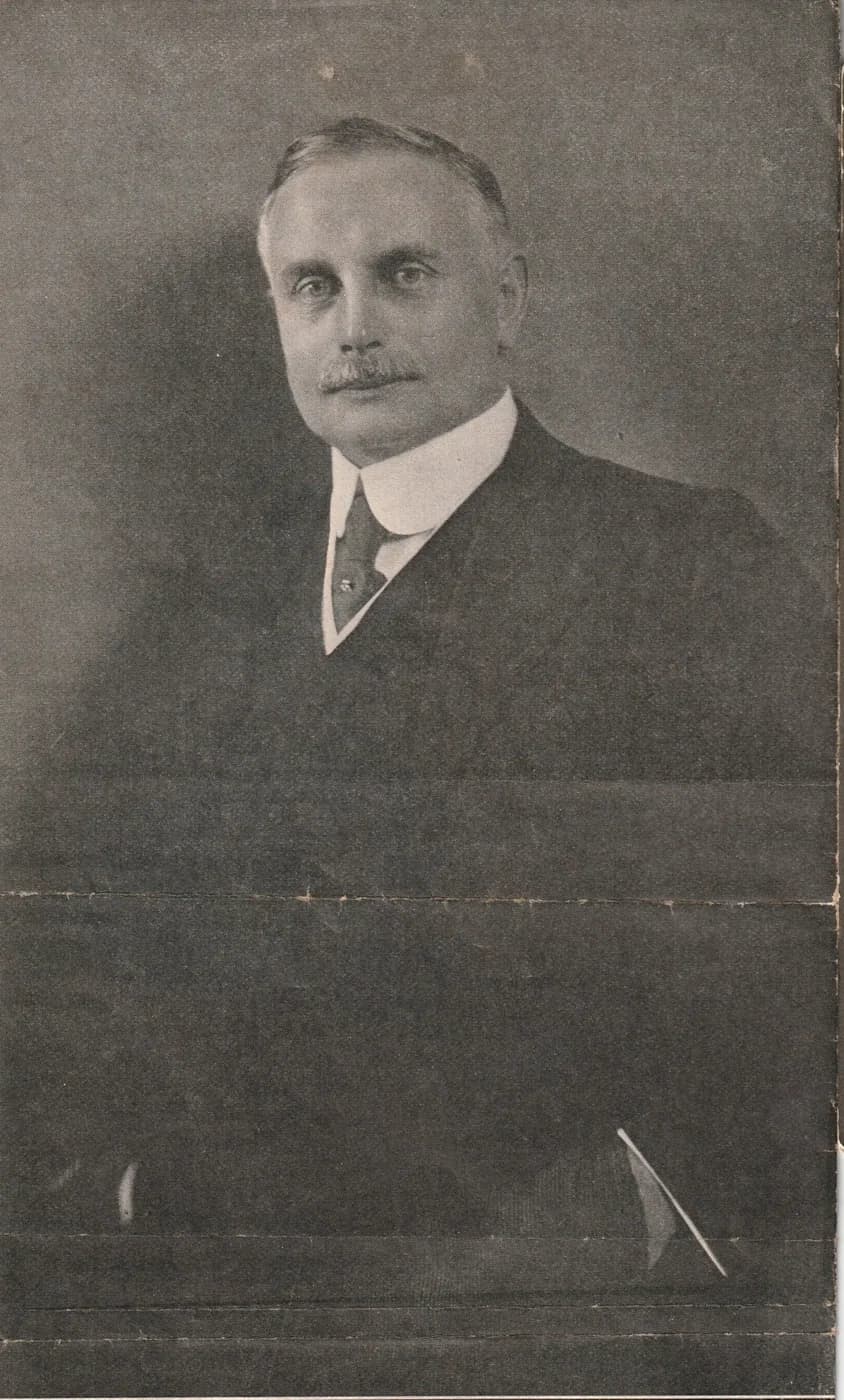 Sir Henry Japp, K.B.E., a printed portrait of a moustached man in a dark suit and high white collar